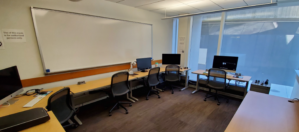 Photo of the Accessibility Room in the Marriott Library showing desks and computer workstations.